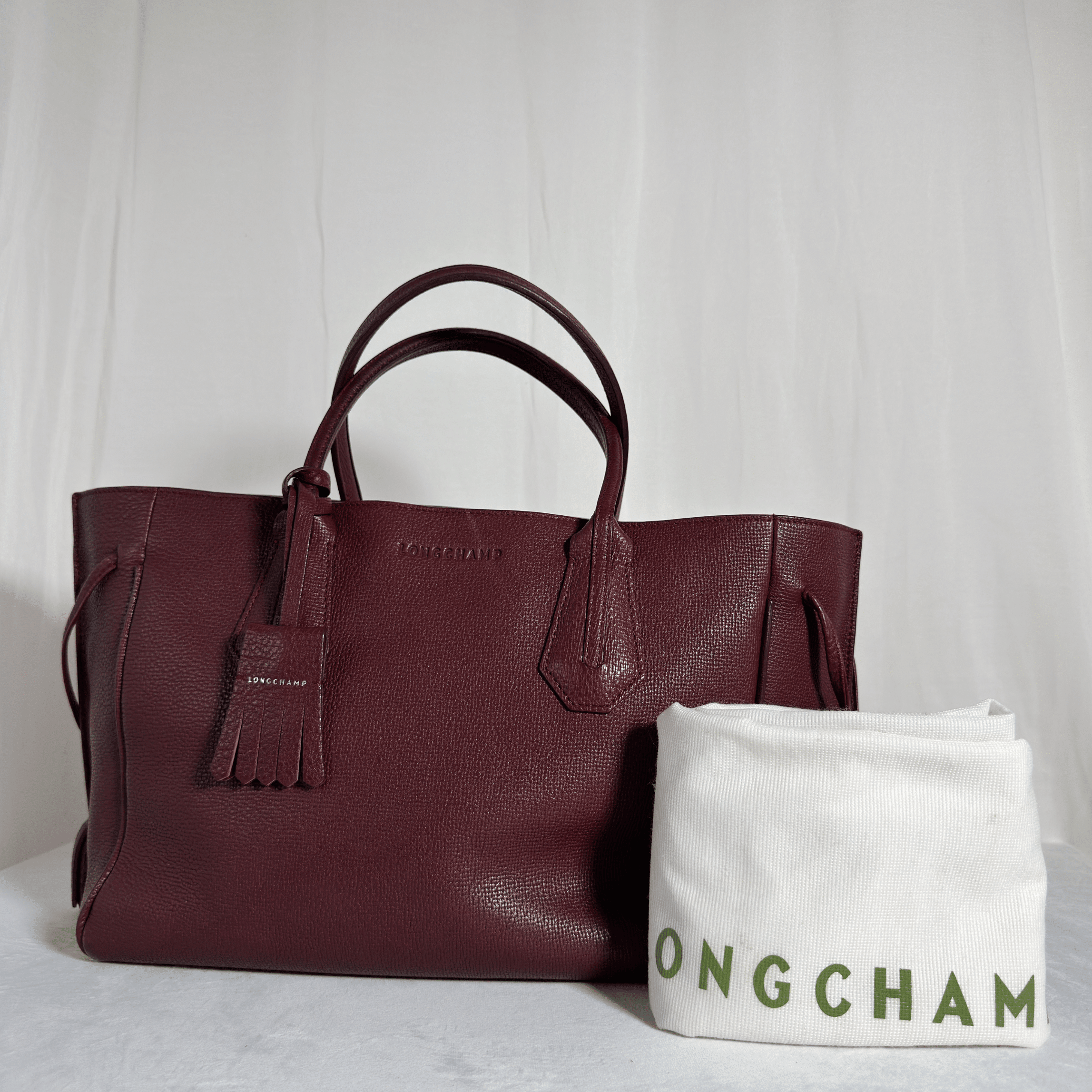 SAC A MAIN LONGCHAMP PENELOPE - CUIR TAURILLON GRAINE BORDEAUX - La Belle Boutique