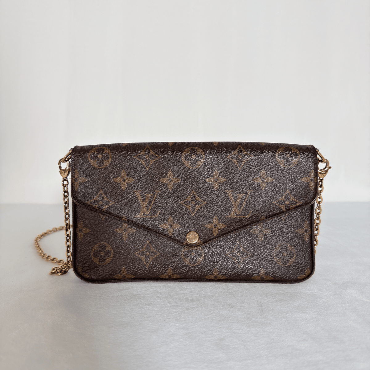 LOUIS VUITTON - POCHETTE FÉLICIE - TOILE MONOGRAM - DOUBLURE FUCHSIA