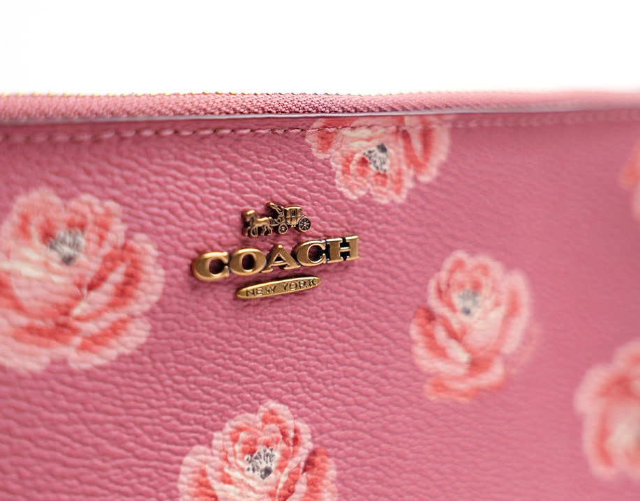 Pochette fleurie cuir Coach