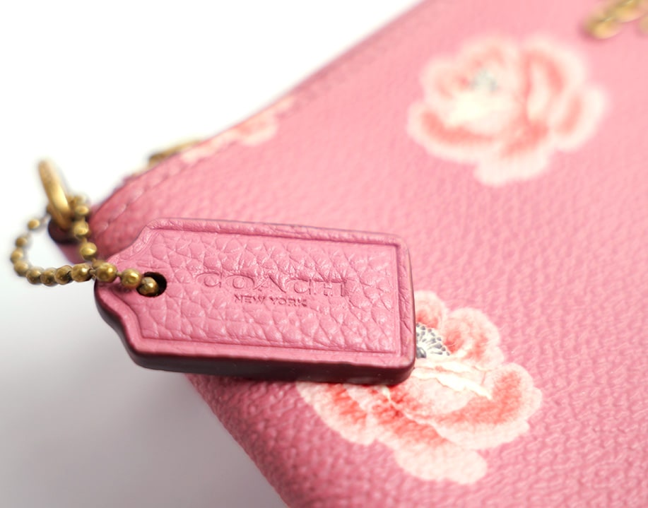 Pochette fleurie cuir Coach