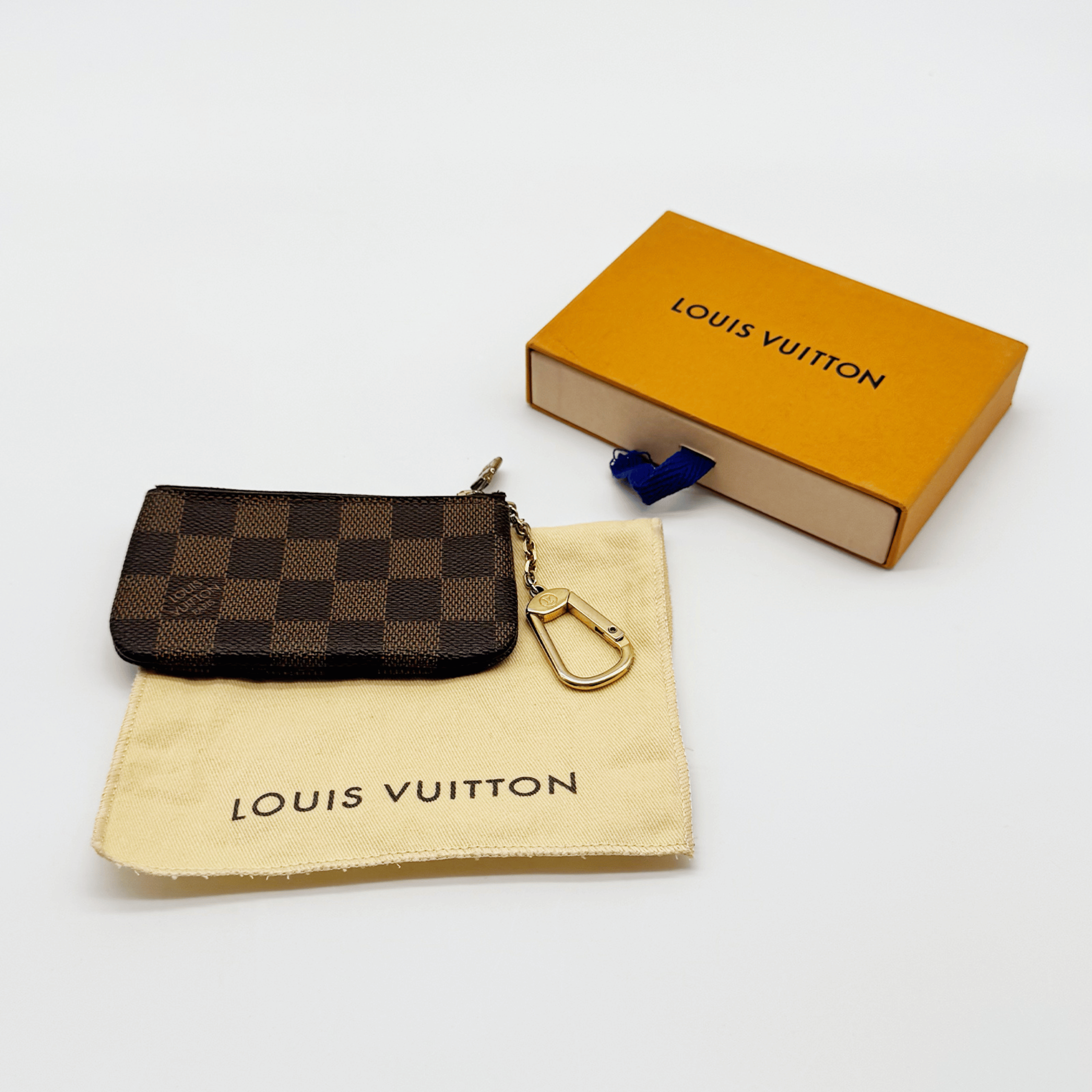 Louis Vuitton Pochette Clés Damier Ébène très bon état authentifiée - La Belle Boutique