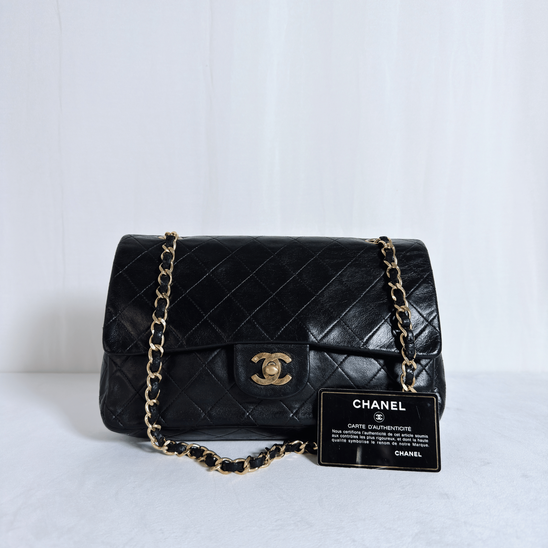 SAC BANDOULIERE CHANEL CLASSIQUE FLAP 25 - CUIR AGNEAU MATELASSE NOIR VINTAGE