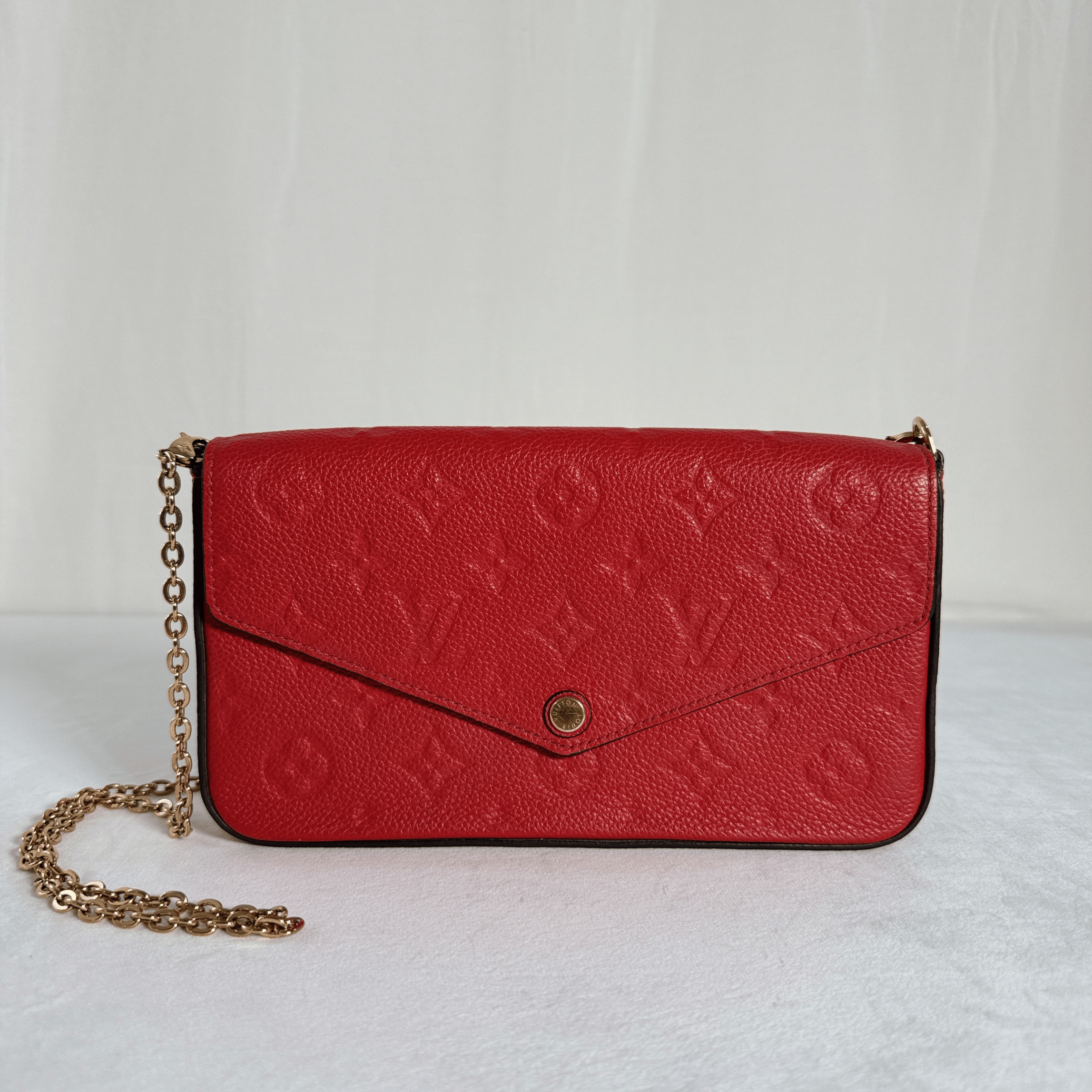 POCHETTE LOUIS VUITTON FELICIE –  CUIR EMPREINTE ROUGE