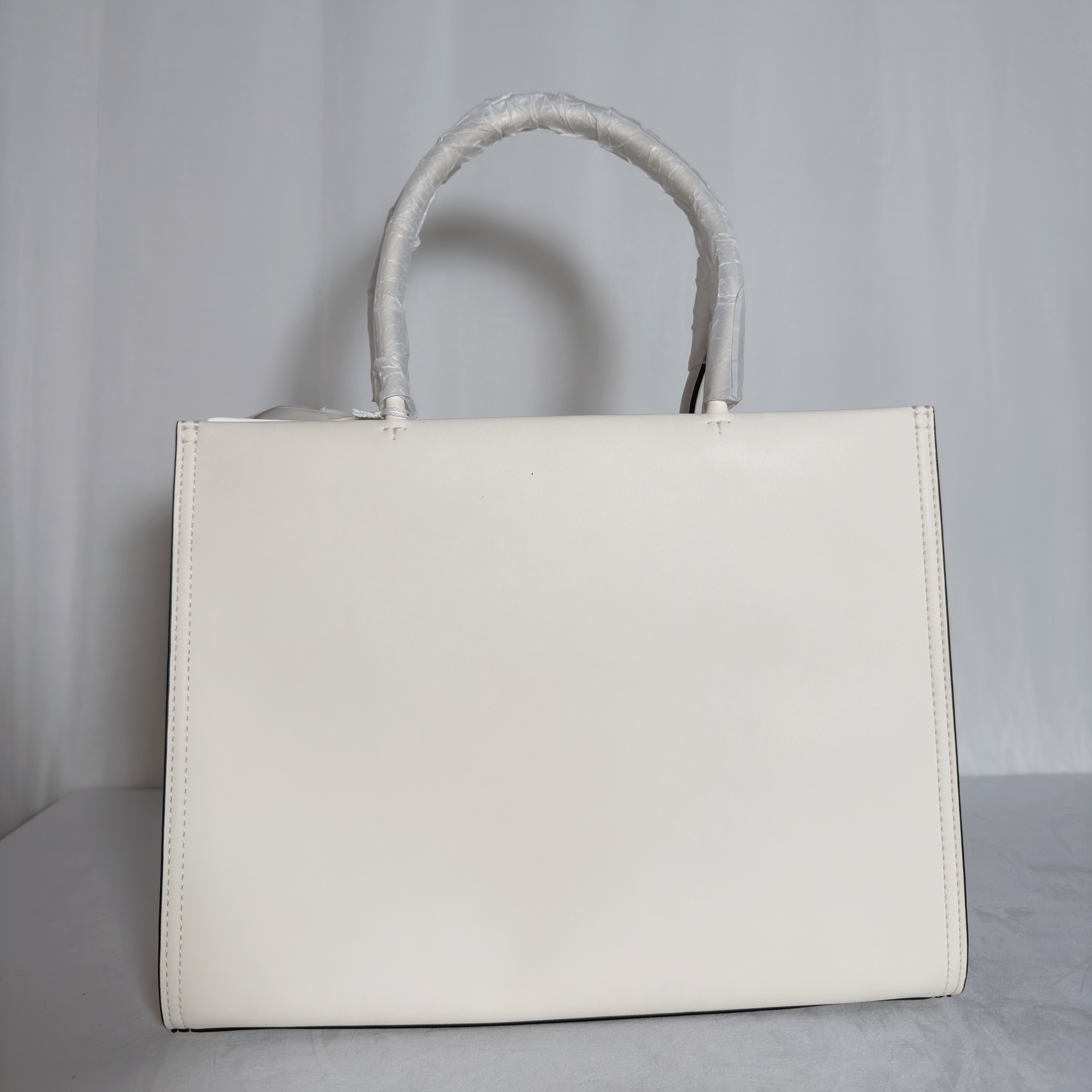 TORY BURCH - SAC TOTE ELLA BIO - CUIR VEGAN IVOIRE / LOGO ROND RELIEF