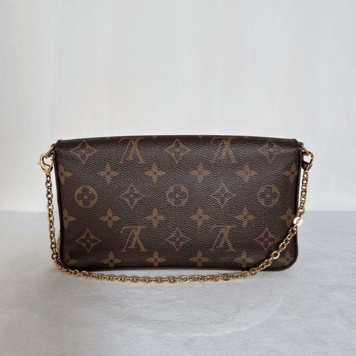 LOUIS VUITTON - POCHETTE FÉLICIE - TOILE MONOGRAM - DOUBLURE FUCHSIA