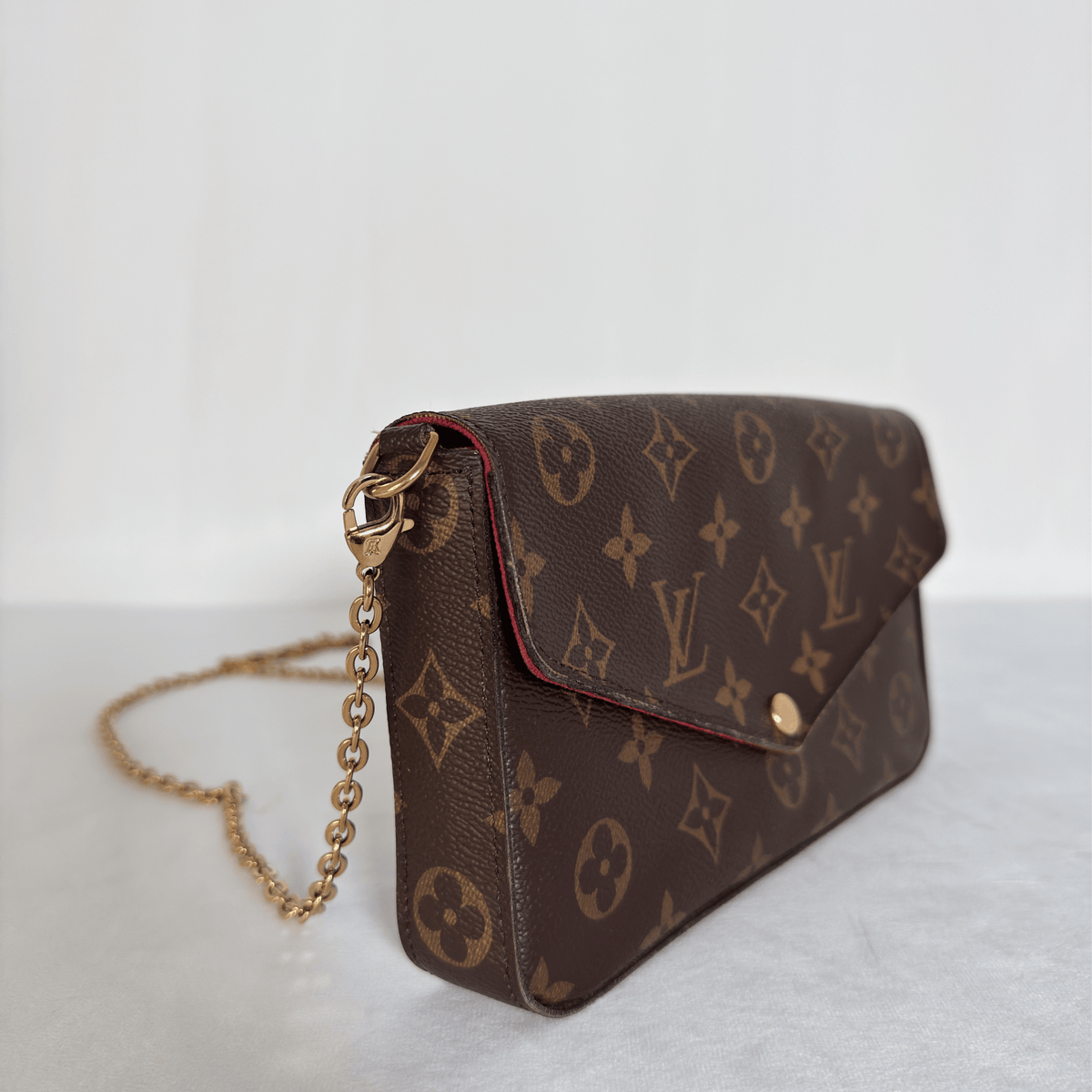 LOUIS VUITTON - POCHETTE FÉLICIE - TOILE MONOGRAM - DOUBLURE FUCHSIA