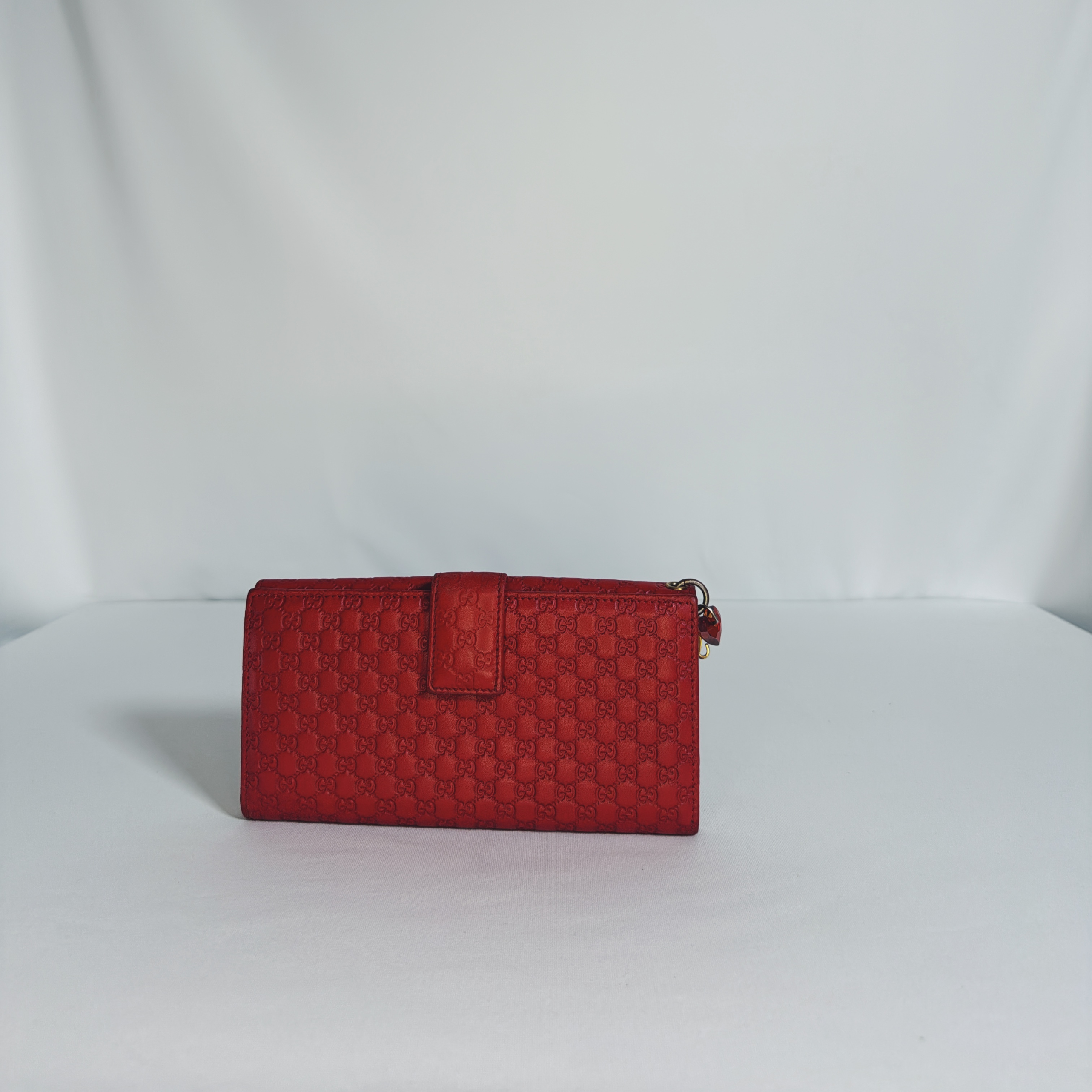 Pochette/ Portefeuille Gucci Guccissima rouge