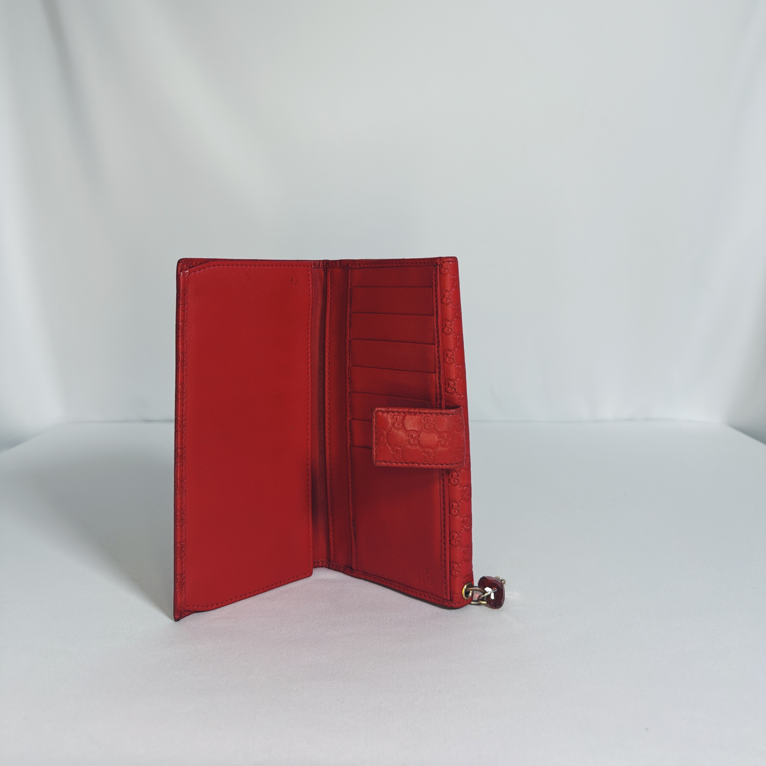 Pochette/ Portefeuille Gucci Guccissima rouge