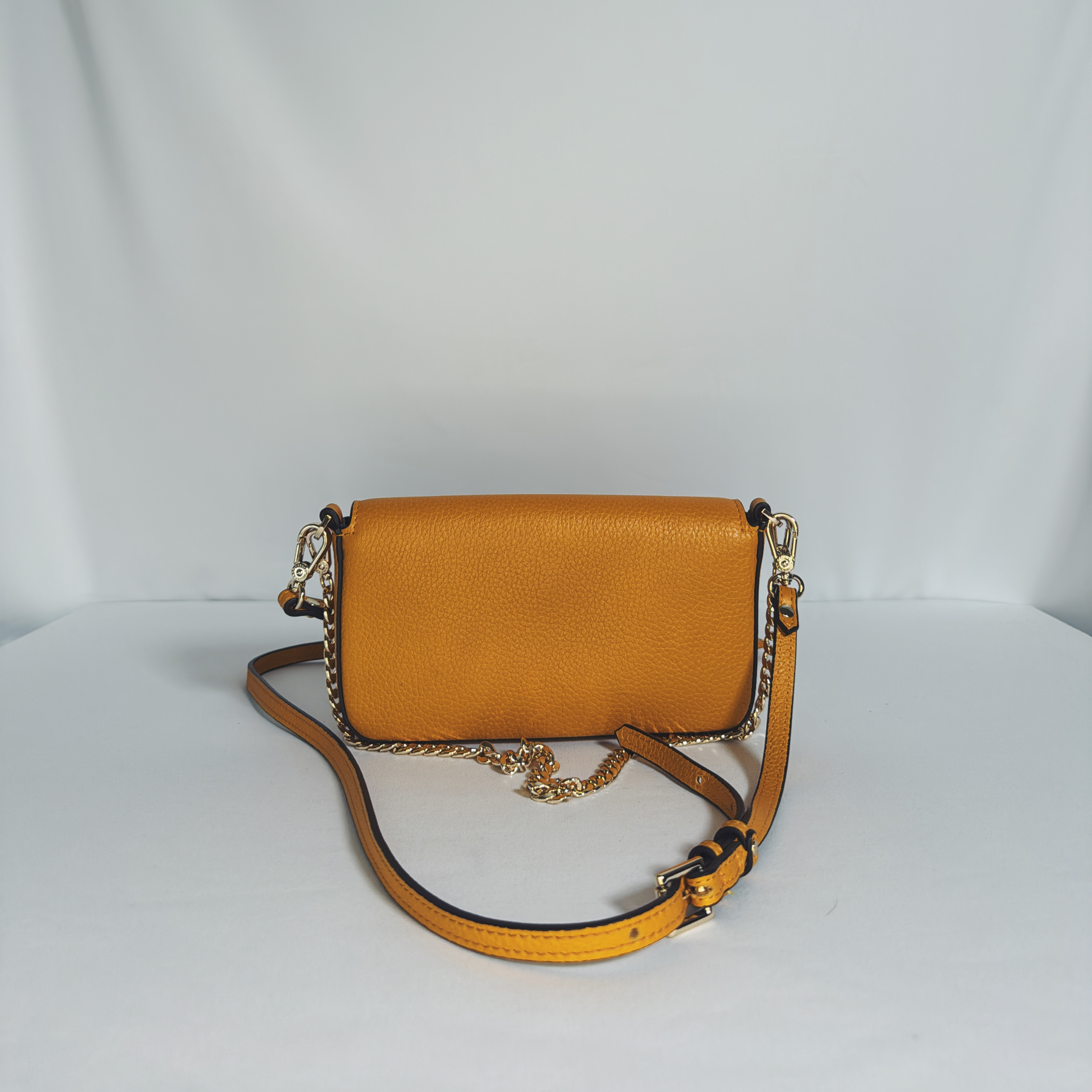 Sac pochette Pourchet Le Club safran en cuir grainé