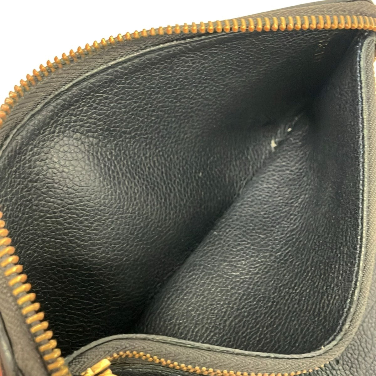 LOUIS VUITTON - PORTEFEUILLE  ZIPPY - CUIR MONOGRAM EMPREINTE NOIR